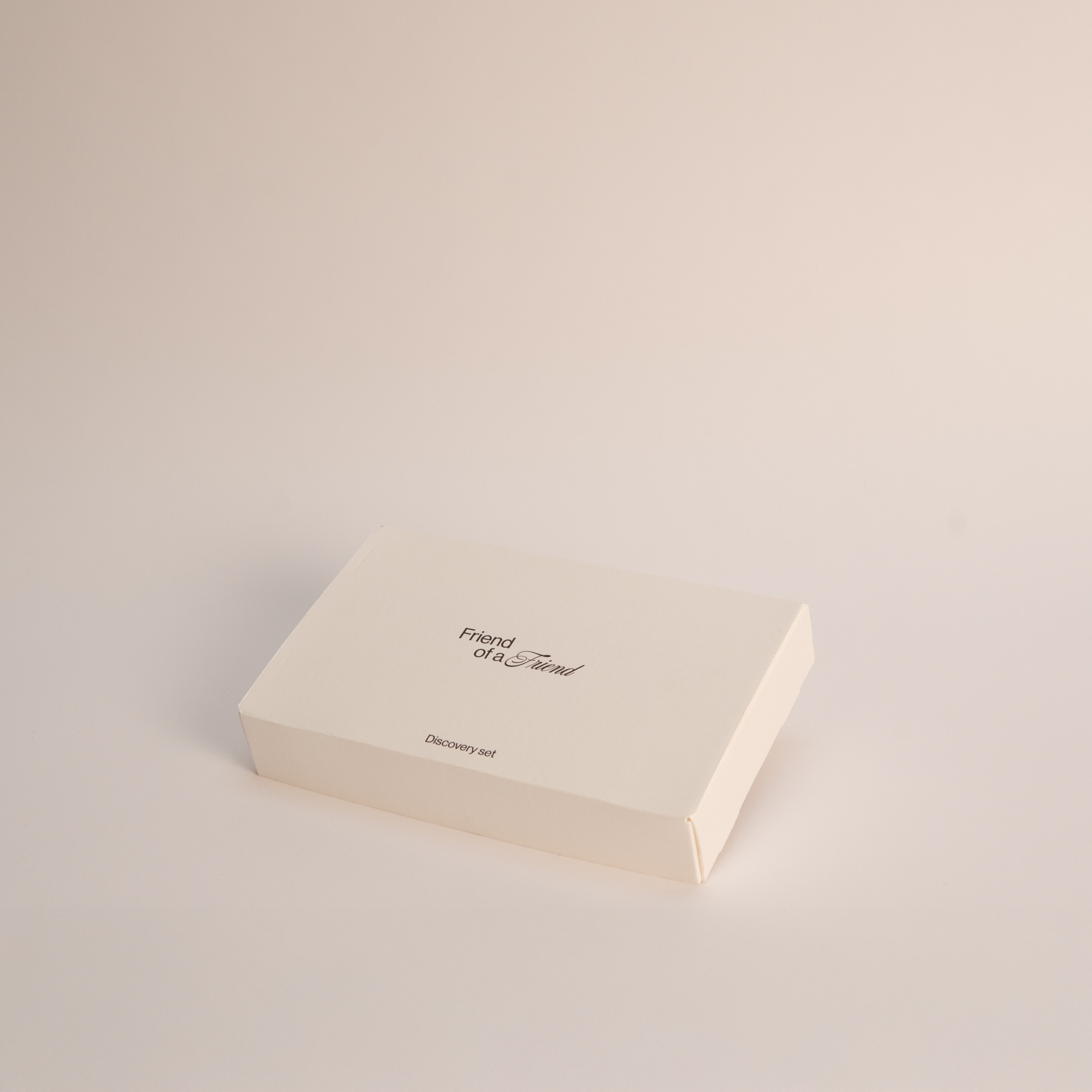 Beige box with 'Friend of a Friend' logo on a light beige background